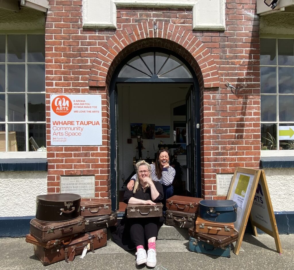Whare Taupua Gallery Curator Bindy Anderson and The Wanda Foundation Trustee Anna van Riel preparing to distribute suitcases to artists.